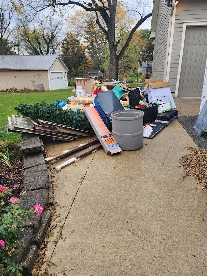 Dumpster being loaded with debris for Demolition Dumpster Rental in Unadilla